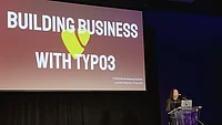 Presentation slide showing 'Building Business with TYPO3' with yellow TYPO3 logo at TYPO3 North America Summit