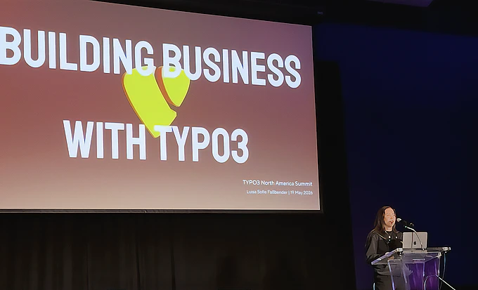 Presentation slide showing 'Building Business with TYPO3' with yellow TYPO3 logo at TYPO3 North America Summit