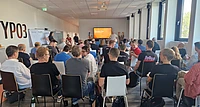 Audience seated before a “Dialogue Day” presentation.
