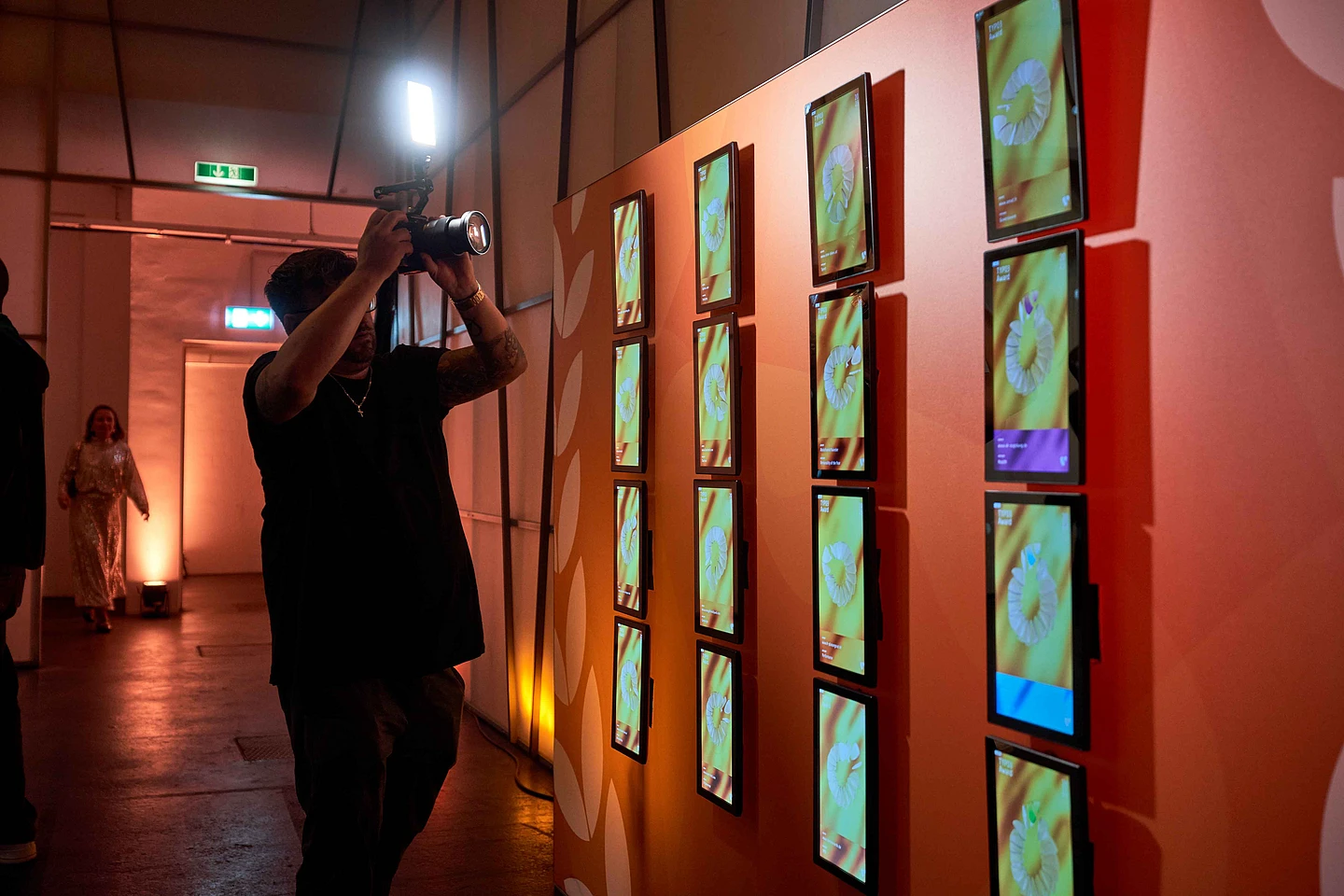 A wall display shows TYPO3 Award screens arranged in four columns.